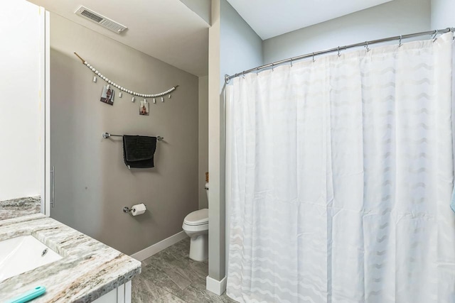 bathroom with hardwood / wood-style floors, vanity, and toilet