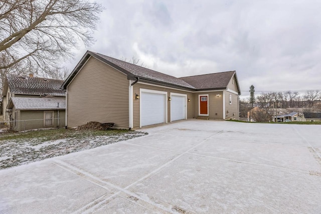 view of property exterior with a garage