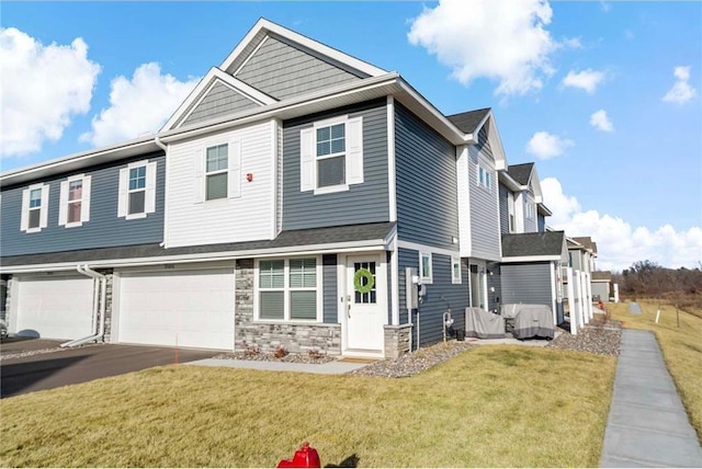 view of front facade with a front yard and a garage