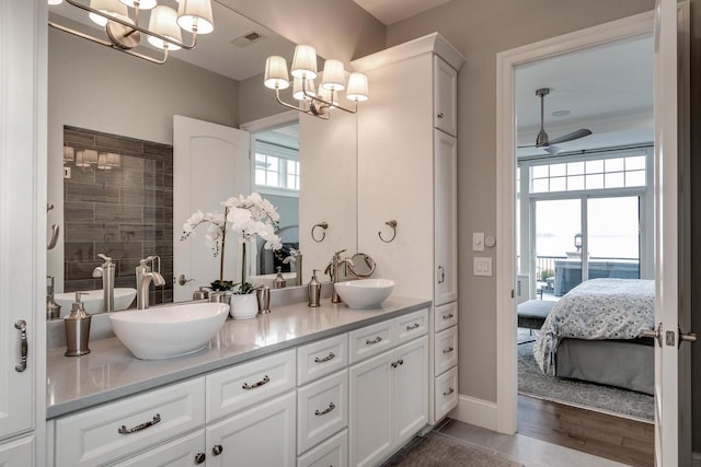 bathroom featuring hardwood / wood-style floors, vanity, and ceiling fan