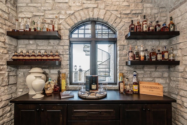 bar with dark brown cabinetry