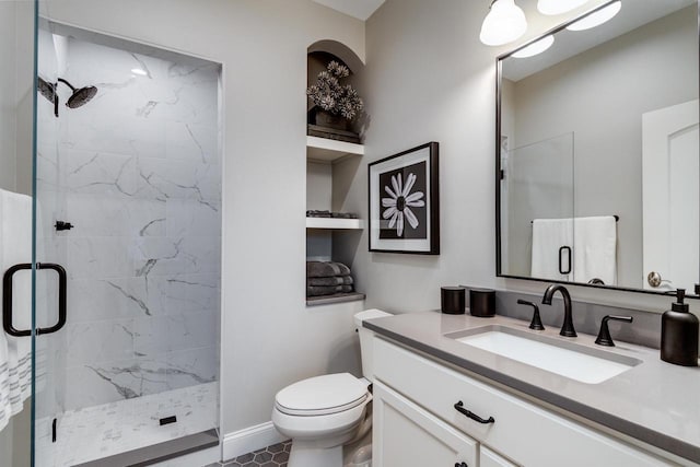 bathroom with tile patterned flooring, vanity, toilet, and an enclosed shower