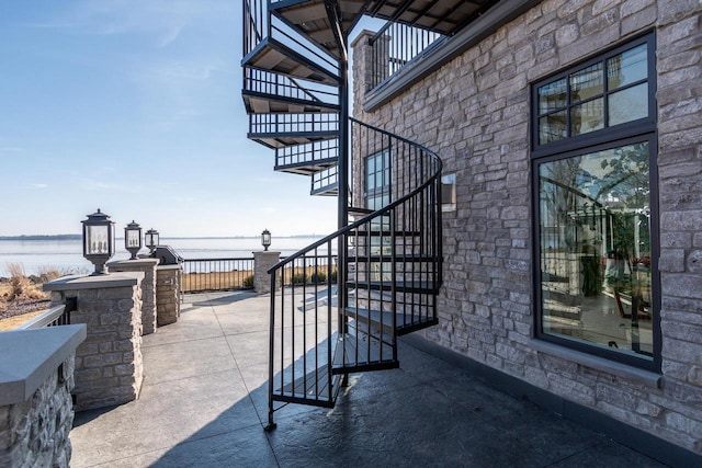 view of patio / terrace with a water view