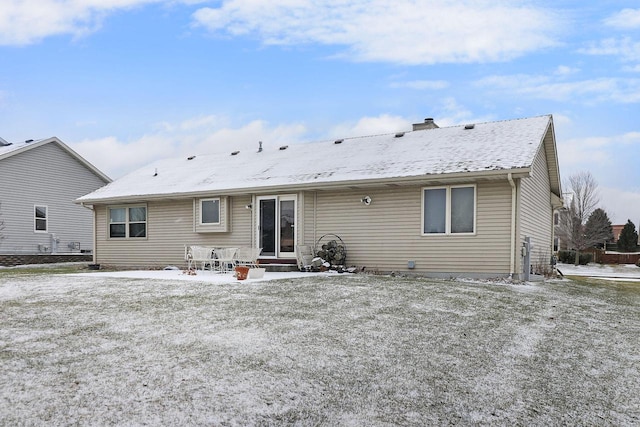 rear view of property featuring a patio area