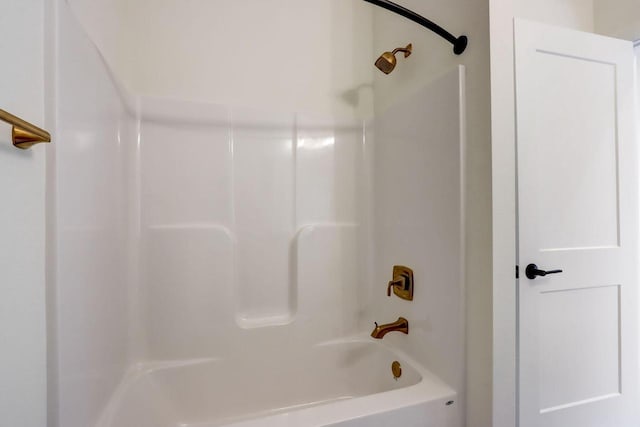 bathroom with washtub / shower combination