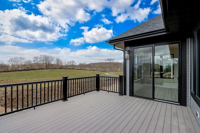 wooden terrace with a lawn