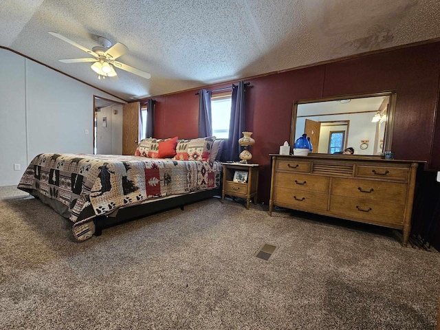 bedroom featuring carpet flooring, a textured ceiling, ceiling fan, and lofted ceiling