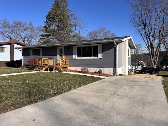 view of front of property with a front lawn and a deck