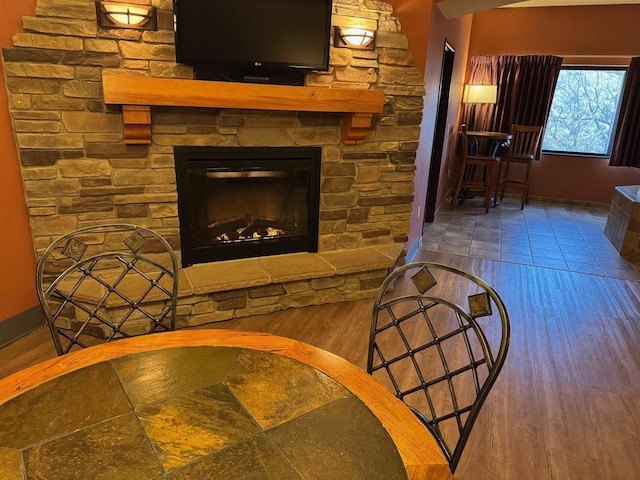 interior space with a fireplace and hardwood / wood-style floors