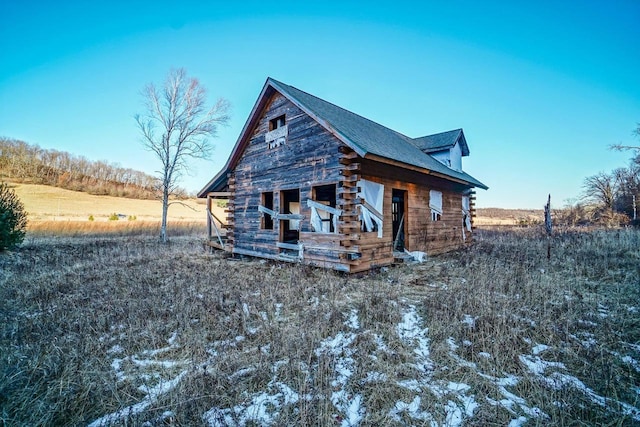 view of property exterior featuring a rural view