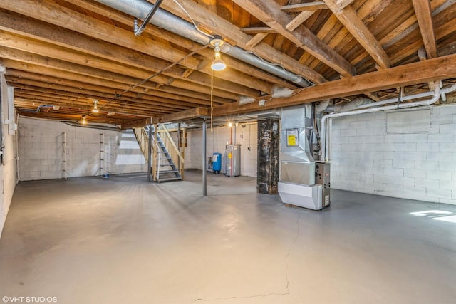 basement with gas water heater and heating unit