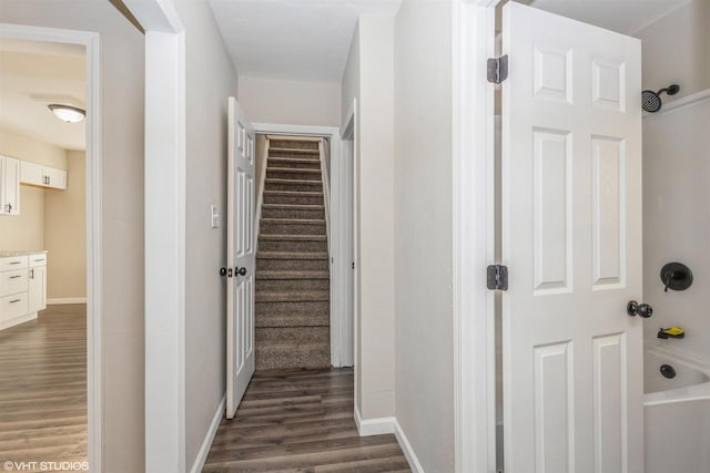 hallway with dark hardwood / wood-style flooring