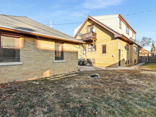 view of side of property with a balcony