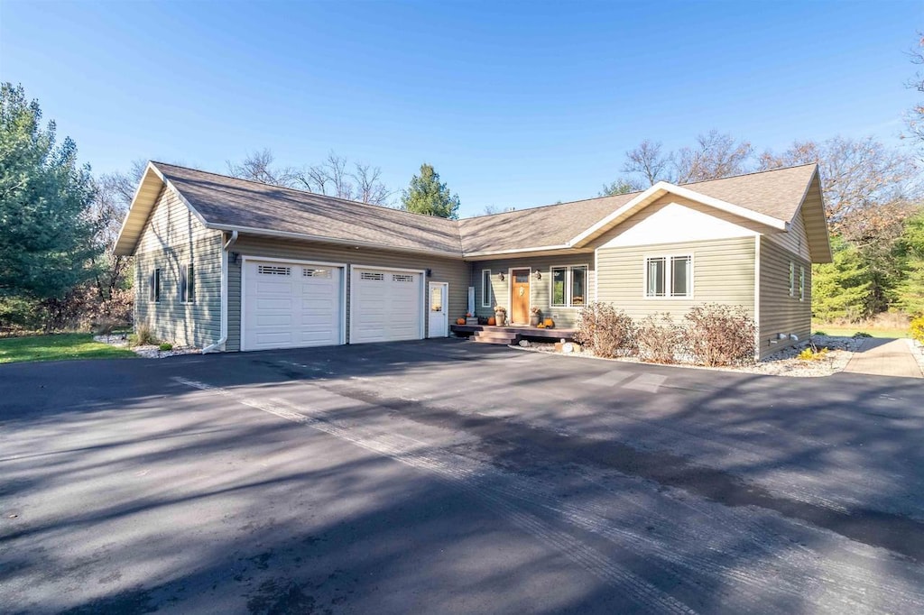 ranch-style home with a garage