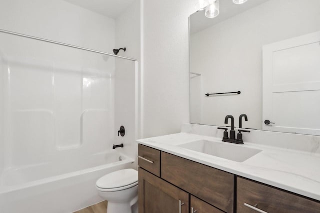 full bathroom with vanity, shower / tub combination, and toilet