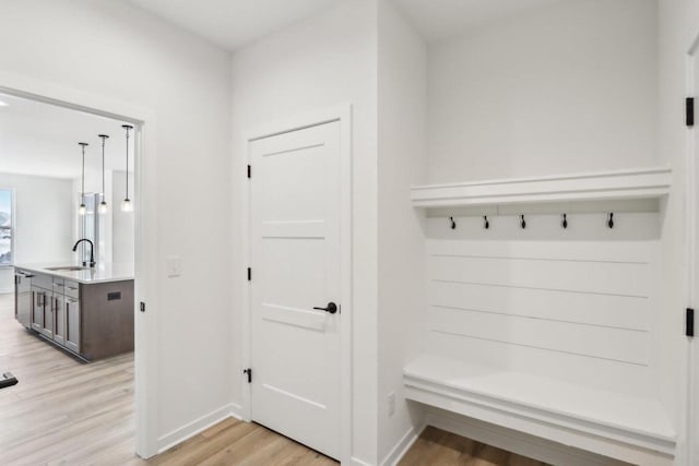 mudroom featuring light hardwood / wood-style floors and sink