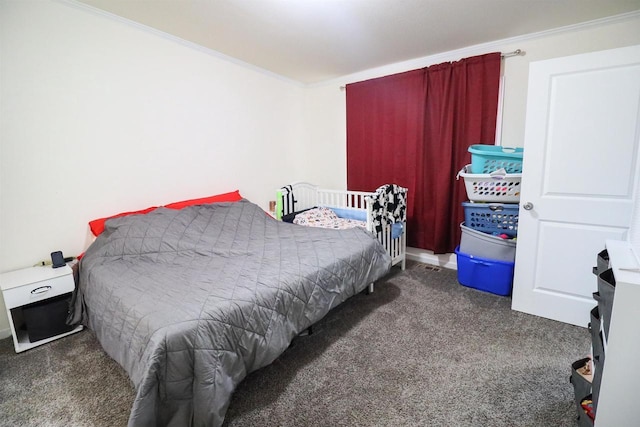 bedroom featuring dark colored carpet and crown molding