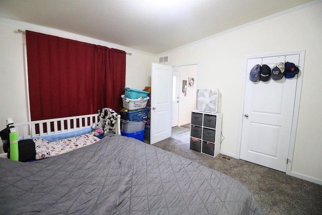 carpeted bedroom featuring crown molding