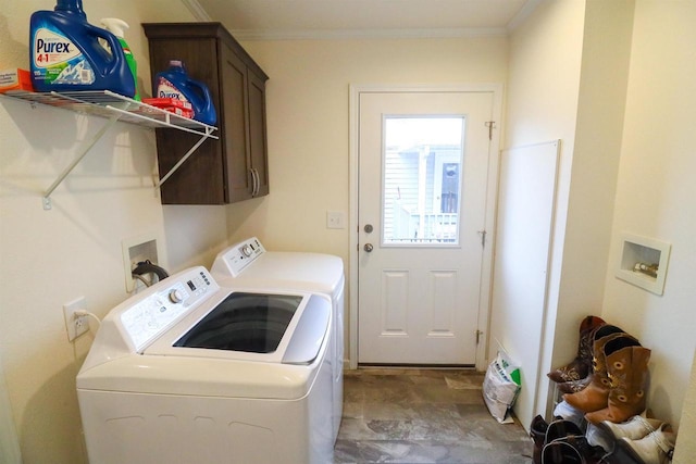 laundry area with cabinets, washing machine and dryer, and crown molding