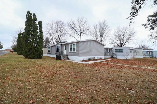 ranch-style home featuring a front yard