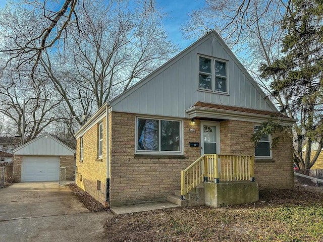 view of front of property featuring an outdoor structure and a garage