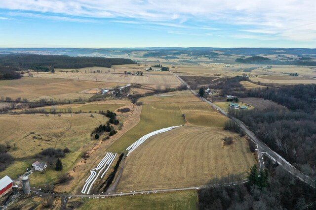 birds eye view of property featuring a rural view