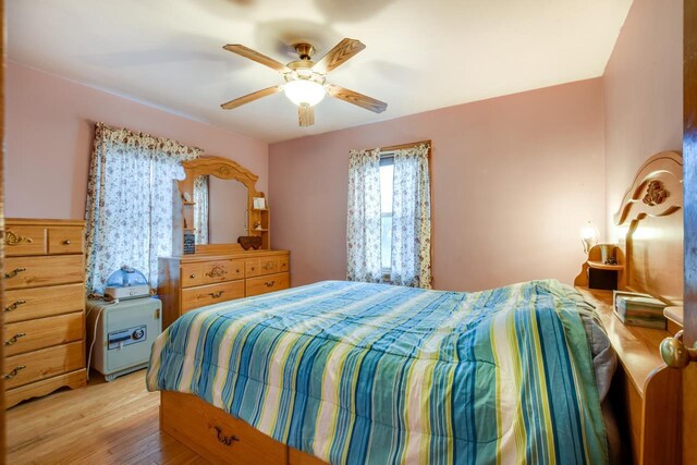 bedroom featuring ceiling fan and light hardwood / wood-style flooring