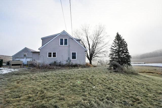 view of side of property with a yard