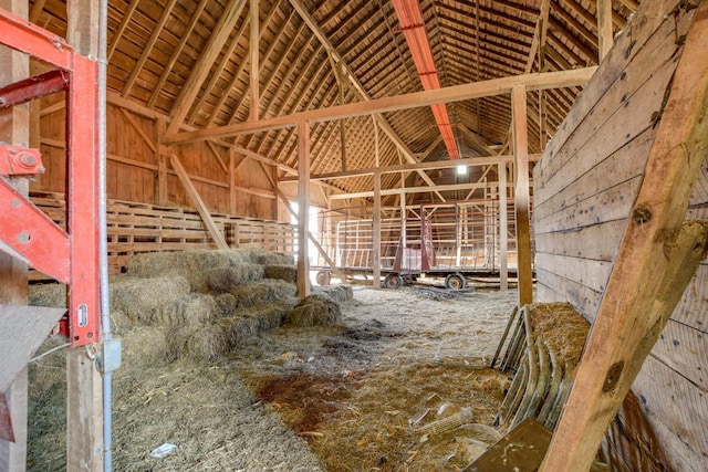 miscellaneous room with high vaulted ceiling