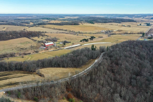 birds eye view of property featuring a rural view