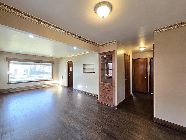 unfurnished living room featuring dark hardwood / wood-style floors