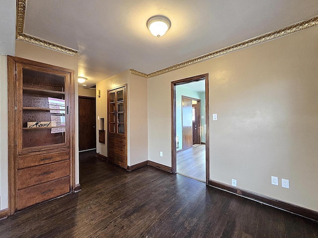 empty room featuring dark hardwood / wood-style floors