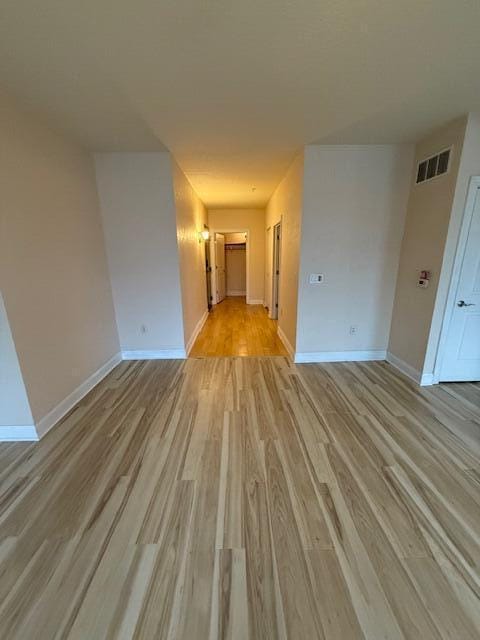 spare room featuring light wood-type flooring