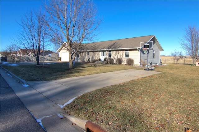 ranch-style house with a front yard and a garage