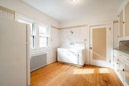 interior space with light hardwood / wood-style floors and radiator