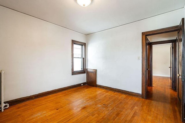 unfurnished room featuring hardwood / wood-style flooring