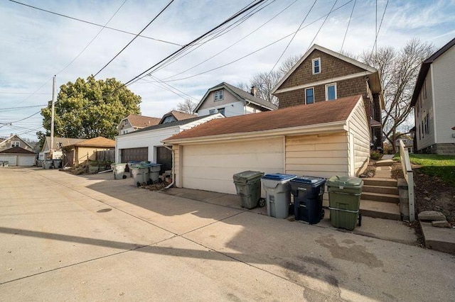 view of front facade with a garage and an outdoor structure