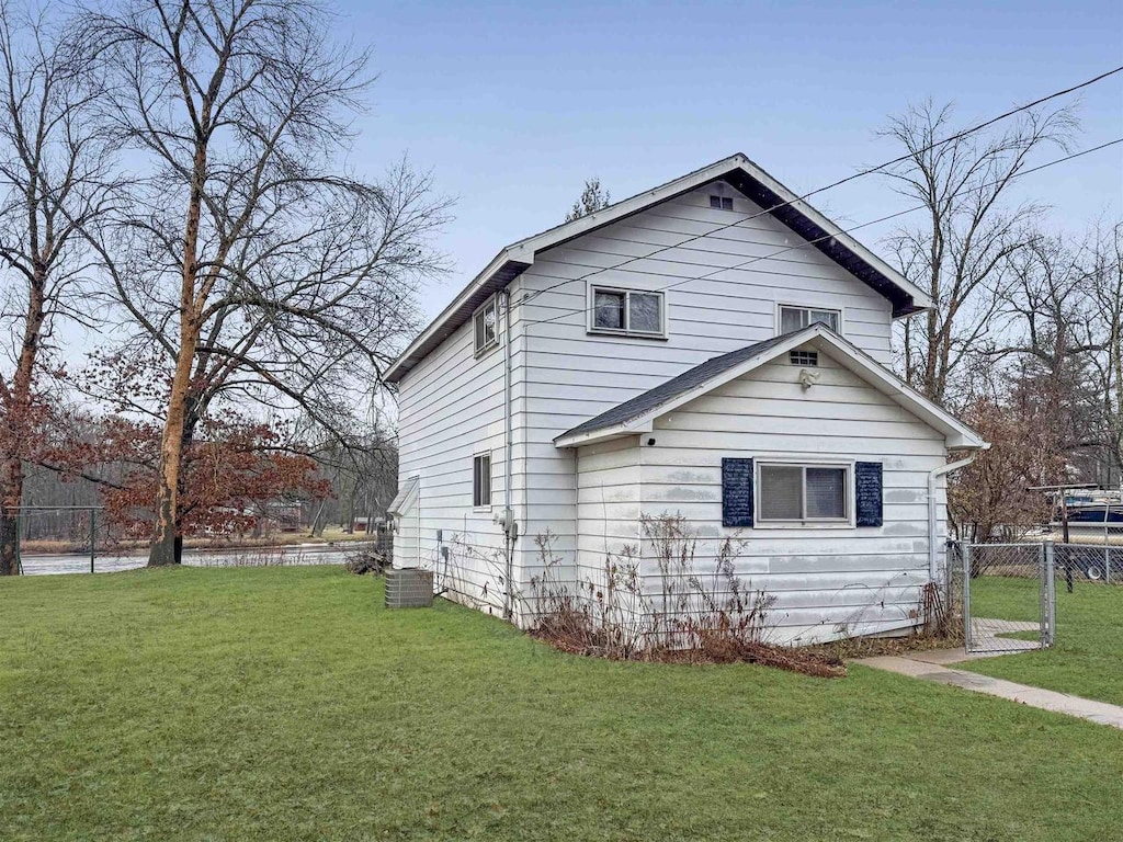 view of side of property with a yard