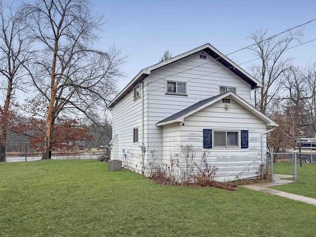 view of side of property with a yard