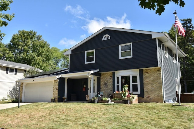 view of front property with a garage and a front yard