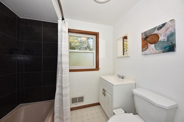 full bathroom featuring vanity, shower / tub combo, and toilet