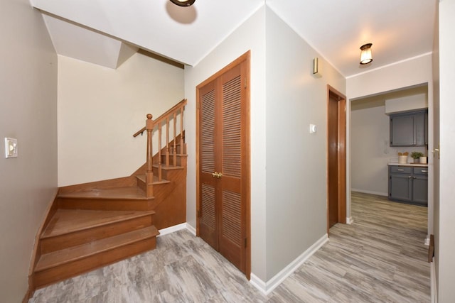 hallway with light hardwood / wood-style flooring