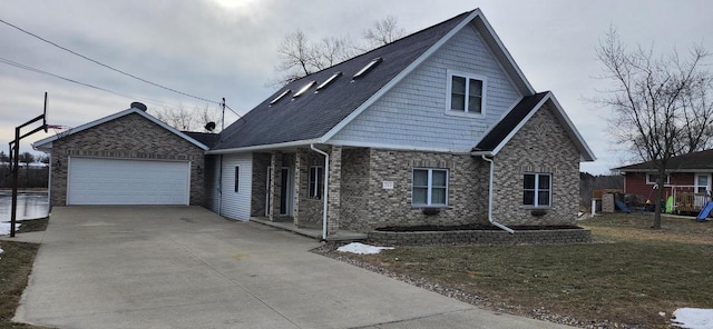 view of front of property featuring a garage and a front yard