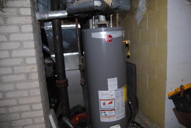 utility room featuring water heater