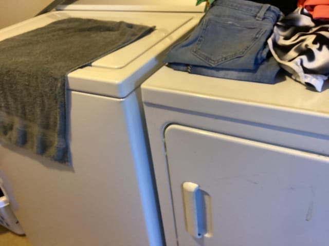 washroom with separate washer and dryer