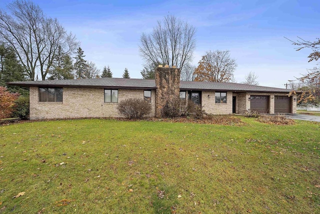 ranch-style house with a front lawn and a garage