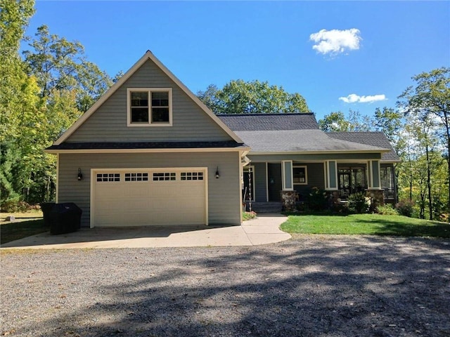 craftsman house featuring a porch and a garage