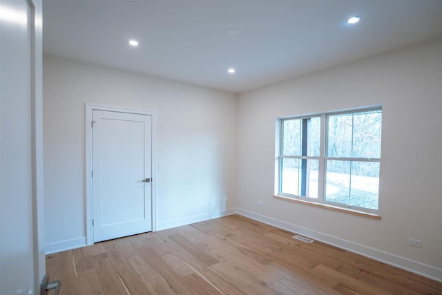 unfurnished room featuring light wood-type flooring