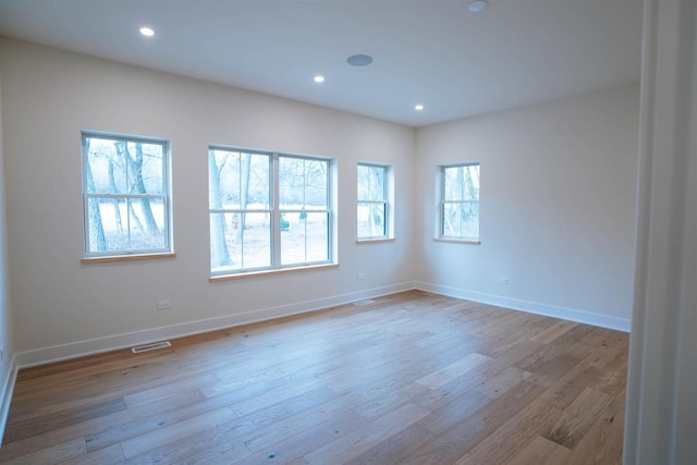 unfurnished room featuring light wood-type flooring