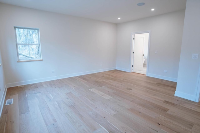 unfurnished room with light wood-type flooring